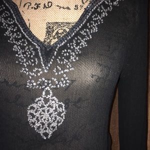 i.e. Silk sheer long sleeve. gemmed.